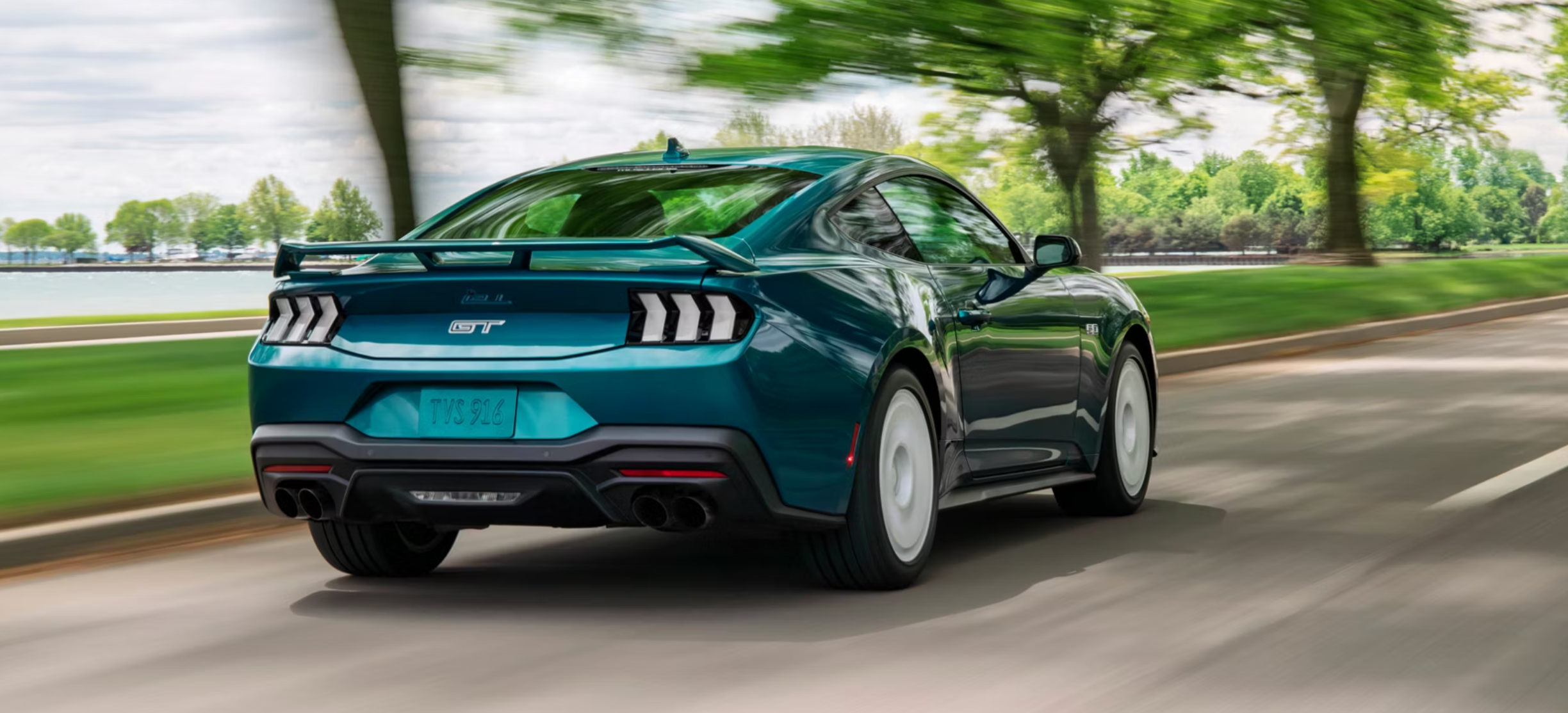 Back bumper of new teal 2026 Ford Mustang in Marietta, OH
